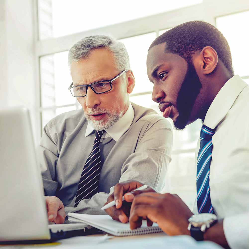 men working at computer